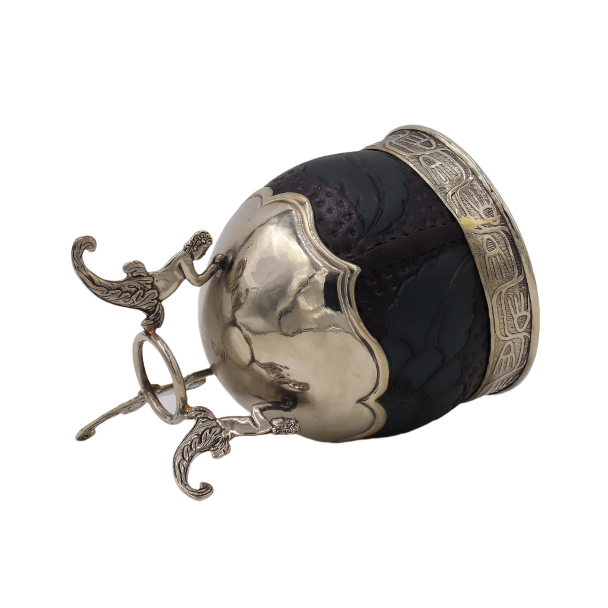 Profil/oblique : corps noir texturé, trépied bronze, virole travaillée.